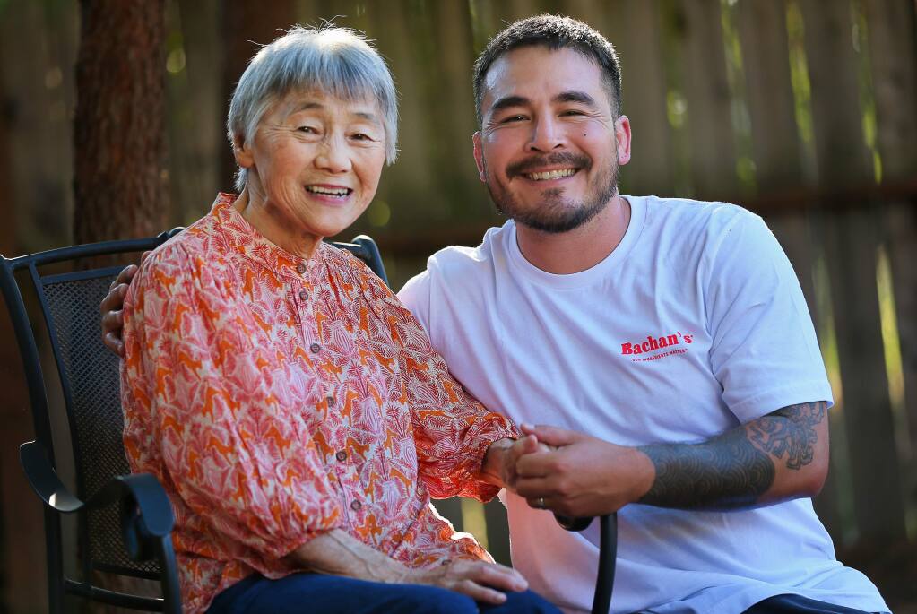 Justin Gill with his grandmother, Judy Yokoyama, who he calls Bachan. Gill is the founder of Bachan's Japanese Barbecue Sauce, inspired by his grandmother.(Christopher Chung/ The Press Democrat)