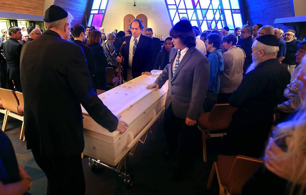 Dennis Judd, middle with his son Daniel Judd escort the casket of their mother and grandmother Lillian Judd, Wednesday June 8, 2016 during a service at Congregation Beth Ami in Santa Rosa. A fixture in Sonoma County's Jewish community, Lillian Judd survived Auschwitz during the Holocaust in WWII. She was 93. (Kent Porter / Press Democrat) 2016