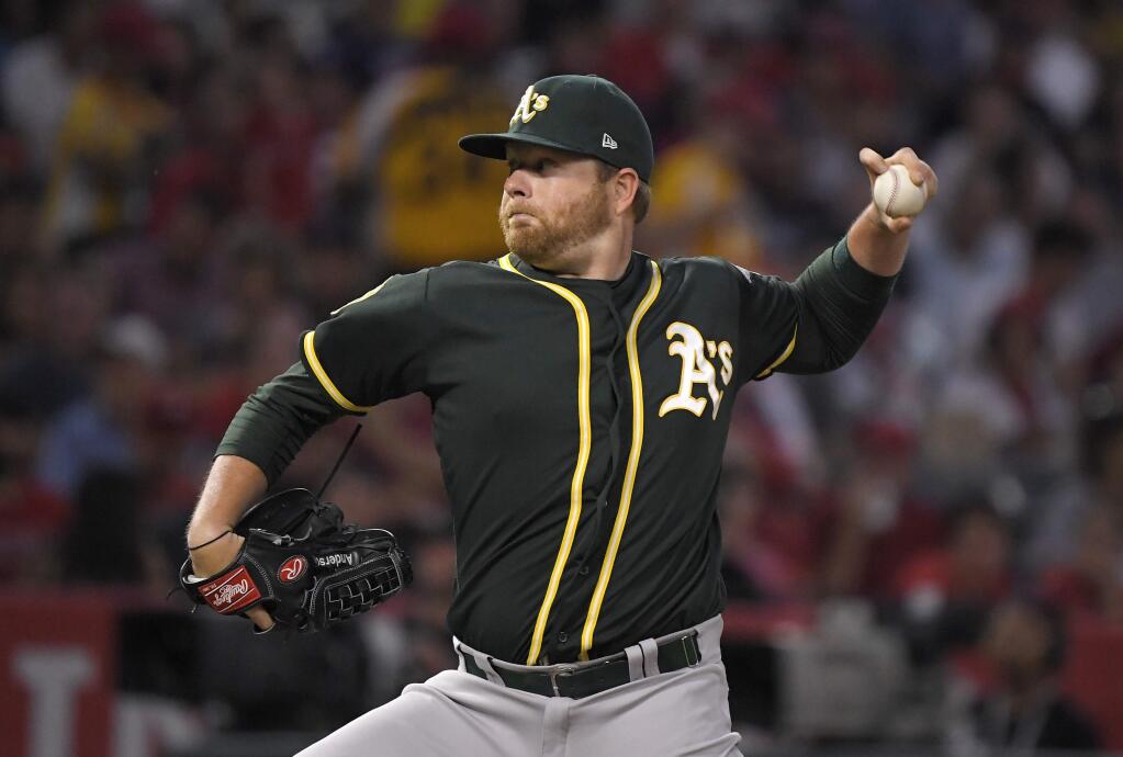 Oakland Athletics starting pitcher Brett Anderson throws during the first inning of the team's baseball game against the Los Angeles Angels on Friday, Aug. 10, 2018, in Anaheim, Calif. (AP Photo/Mark J. Terrill)