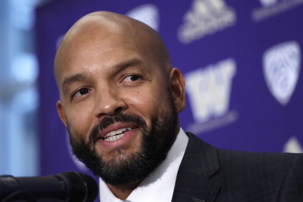 In this Dec. 3, 2019, file photo, Washington defensive coordinator Jimmy Lake speaks during a news conference about taking over the head coaching position, in Seattle. (AP Photo/Elaine Thompson, File)