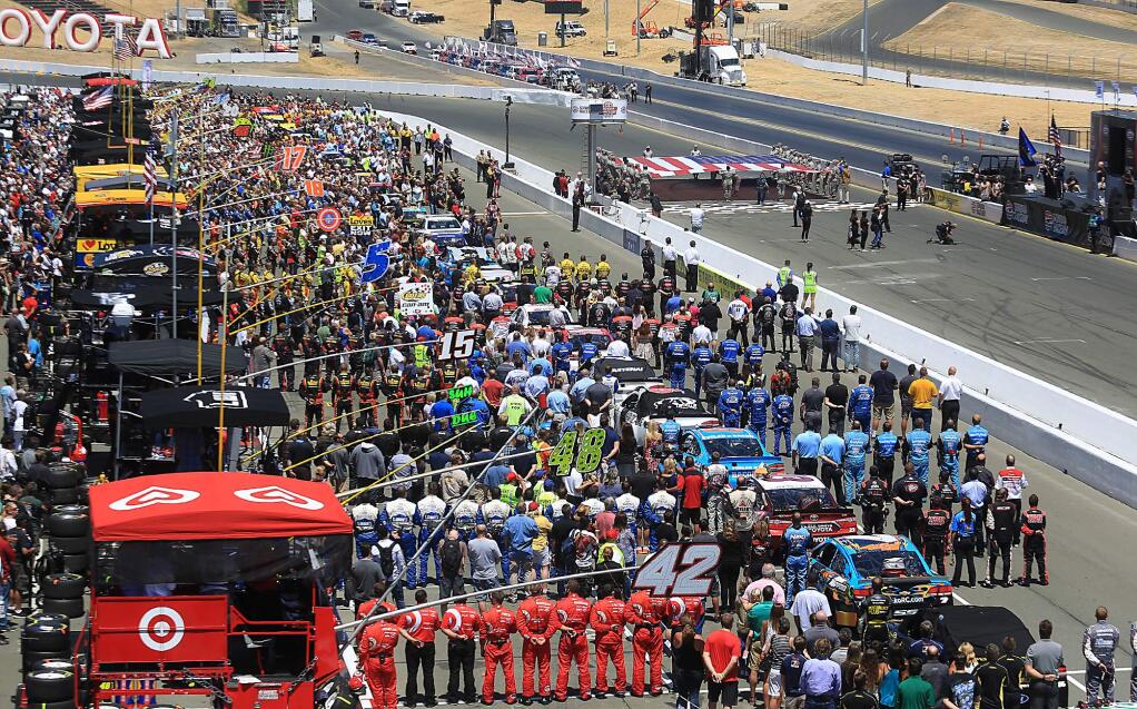 Pit row is jammed for the National Anthem prior to the start of the Toyota / Save Mart 350 at Sonoma Raceway, Sunday July 26, 2016. (Kent Porter / Press Democrat) 2016