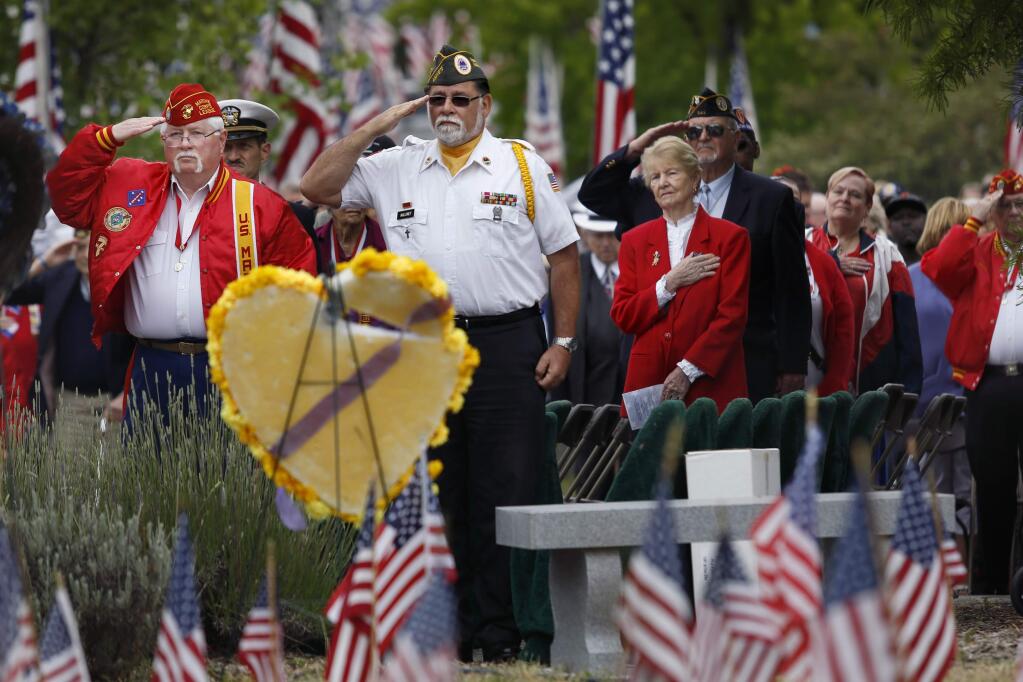 Larry Williams, left, Commandant of the Marine Corps League Detachment 686, and Tim Maloney, AMVETS chaplain, join with hundreds to remember their fellow veterans during the Avenue of the Flags ceremony at Santa Rosa Memorial Park in Santa Rosa, on Monday, May 25, 2015. (BETH SCHLANKER/ The Press Democrat)