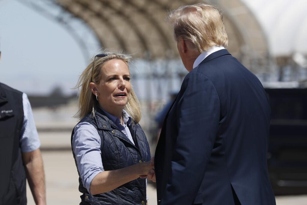 President Donald Trump greets Homeland Security Secretary Kirstjen Nielsen after he arrived on Air Force One at Naval Air Facility El Centro, in El Centro, Calif., Friday April 5, 2019. (AP Photo/Jacquelyn Martin)