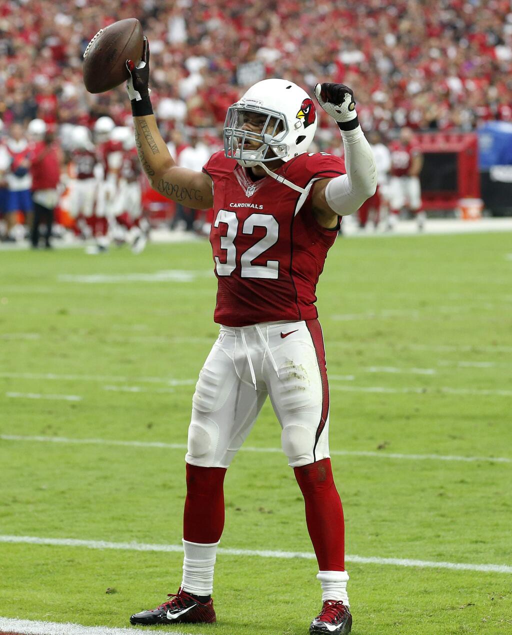 Arizona Cardinals free safety Tyrann Mathieu (32) celebrates his second interception of the game against the San Francisco 49ers during the first half of an NFL football game, Sunday, Sept. 27, 2015, in Glendale, Ariz. (AP Photo/Ross D. Franklin)