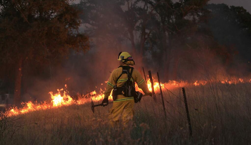The County fire burns in an open field on Knoxville-Berryessa Road , Monday July 2, 2018. (Kent Porter / The Press Democrat) 2018