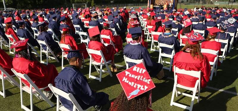 Graduating seniors wait to receive their diplomas during Rancho Cotate High School's commencement ceremony on Friday, May 31, 2013. (Conner Jay/The Press Democrat)