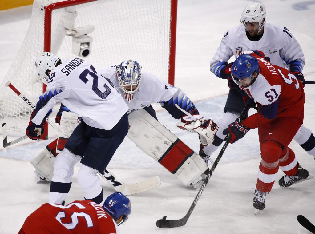 Roman Horak (51), of the Czech Republic, takes a shot at goalie Ryan Zapolski (30), of the United States, during the first period of the quarterfinal round of the men's hockey game at the 2018 Winter Olympics in Gangneung, South Korea, Wednesday, Feb. 21, 2018. (AP Photo/Jae C. Hong)