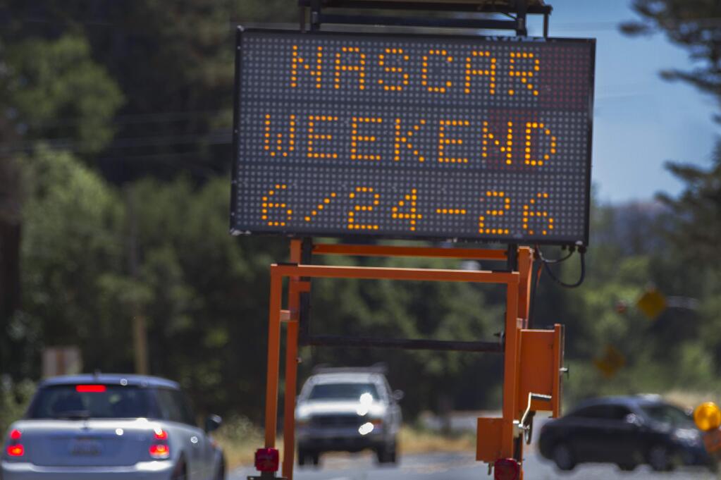 Sign on Broadway warning drivers of upcoming heavy traffic expected for NASCAR weekend. The second part reads 'Expect Delays Hwy 121.' (Robbi Pengelly/Index-Tribune)