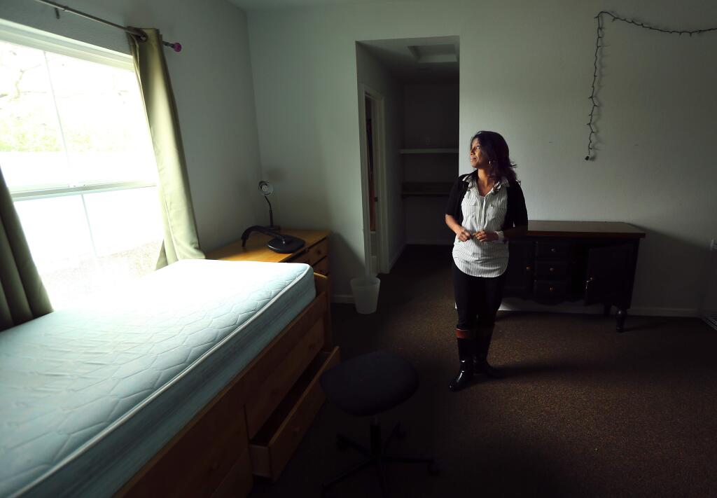 The Sonoma County Children's Village executive director Anjana Utarid in one of the empty rooms for the foster children in one of the 4 homes on the Santa Rosa property that is now up for sale. (JOHN BURGESS / The Press Democrat)