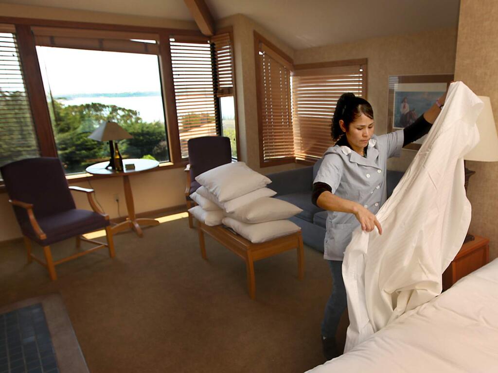 Angelito Alonzo, prepares a room at the Inn of the Tides in Bodega Bay in 2012. (KENT PORTER/ PD)