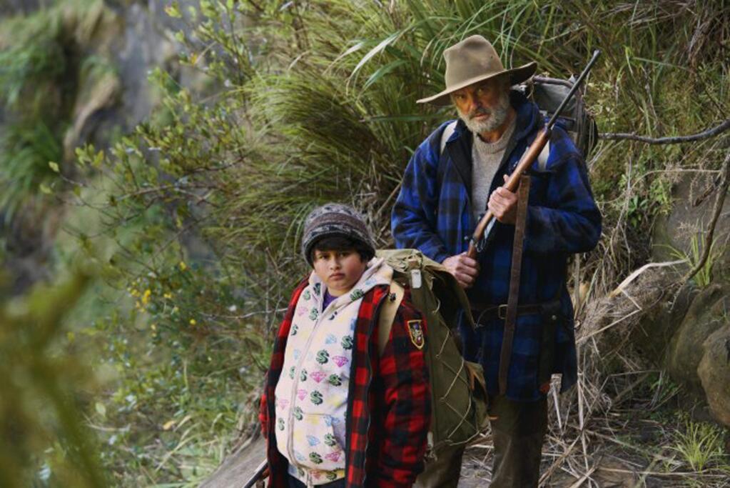 Julian Dennison (left) as a delinquent boy and Sam Neill as his reluctant faster father in the New Zealand comedy 'The Hunt for the Wilderpeople.' (PIKI FILMS)