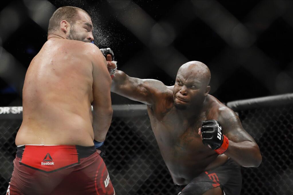 Derrick Lewis, right, punches Bulgaria's Blagoy Ivanov during the second round of a heavyweight mixed martial arts bout at UFC 244, Saturday, Nov. 2, 2019, in New York. Lewis won the fight. (AP Photo/Frank Franklin II)