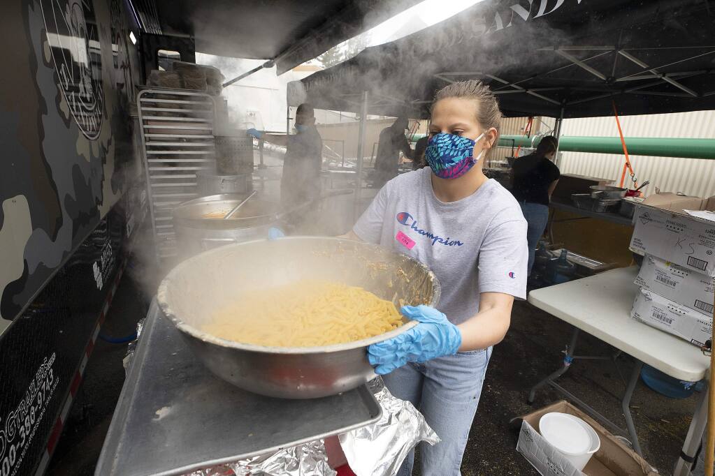 Guy Fieri brought family, friends and his 48-foot Guy's Smokehouse Stagecoach mobile kitchen to feed first responders and hospital workers lunch at Memorial Hospital in Santa Rosa on Wednesday, May 13, 2020. (John Burgess/The Press Democrat)
