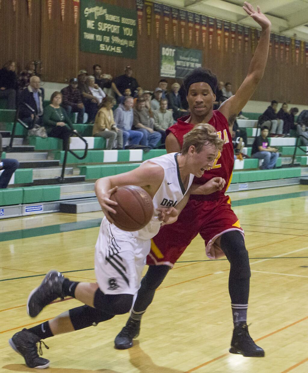 FORWARD LUCK SEVERSON drives hard agains a defender in non-league basketball play last week. The SVHS Dragons took third place in the Stokes Tournament in Kelseyville.