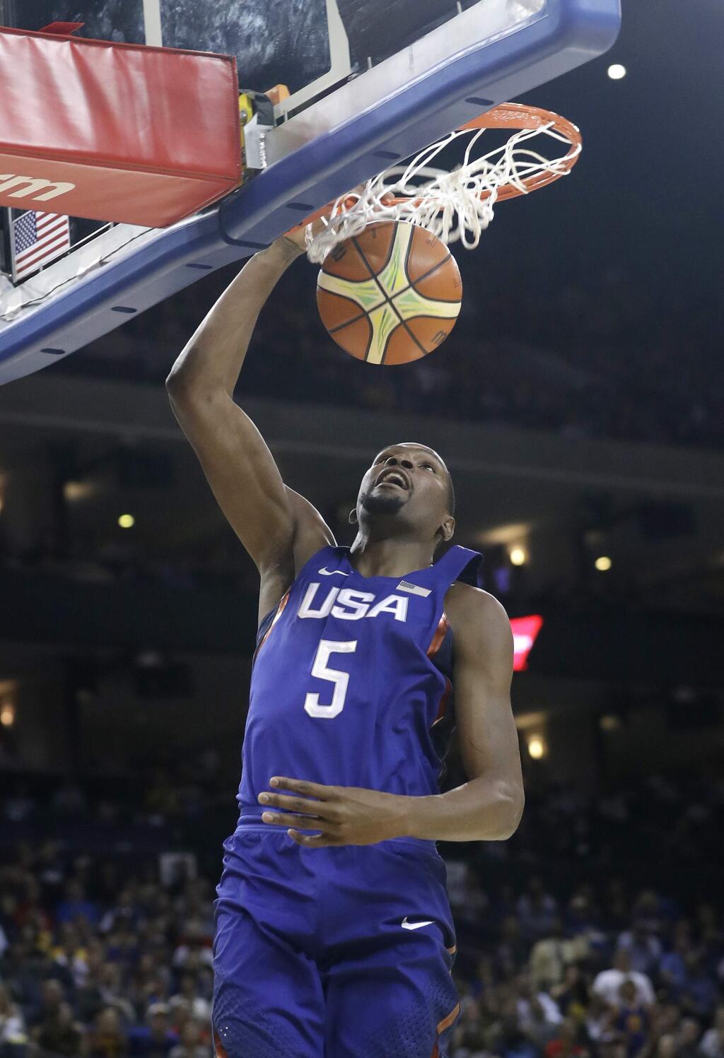 United States' Kevin Durant dunks against China during the first half of an exhibition basketball game Tuesday, July 26, 2016, in Oakland, Calif. (AP Photo/Marcio Jose Sanchez)