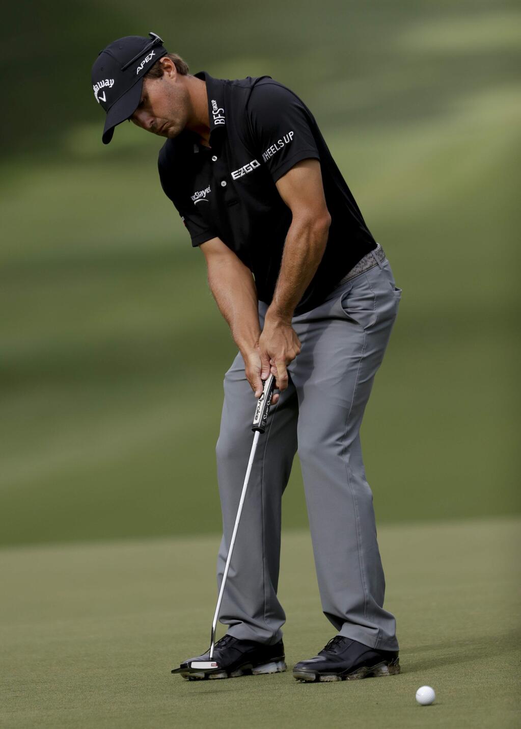 Kevin Kisner putts on the 12th hole during the second round of the PGA Championship golf tournament at the Quail Hollow Club Friday, Aug. 11, 2017, in Charlotte, N.C. (AP Photo/John Bazemore)
