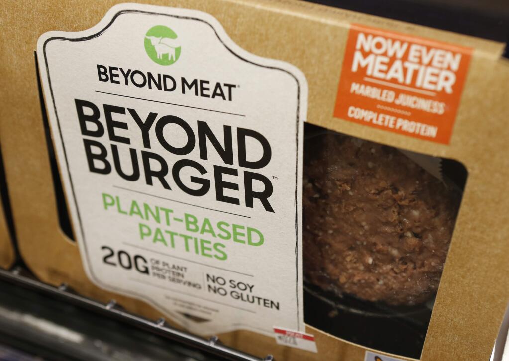 A meatless burger patty called Beyond Burger made by Beyond Meat is displayed at a grocery store in Richmond, Virginia, on June 27, 2019. (AP Photo/Steve Helber, File)
