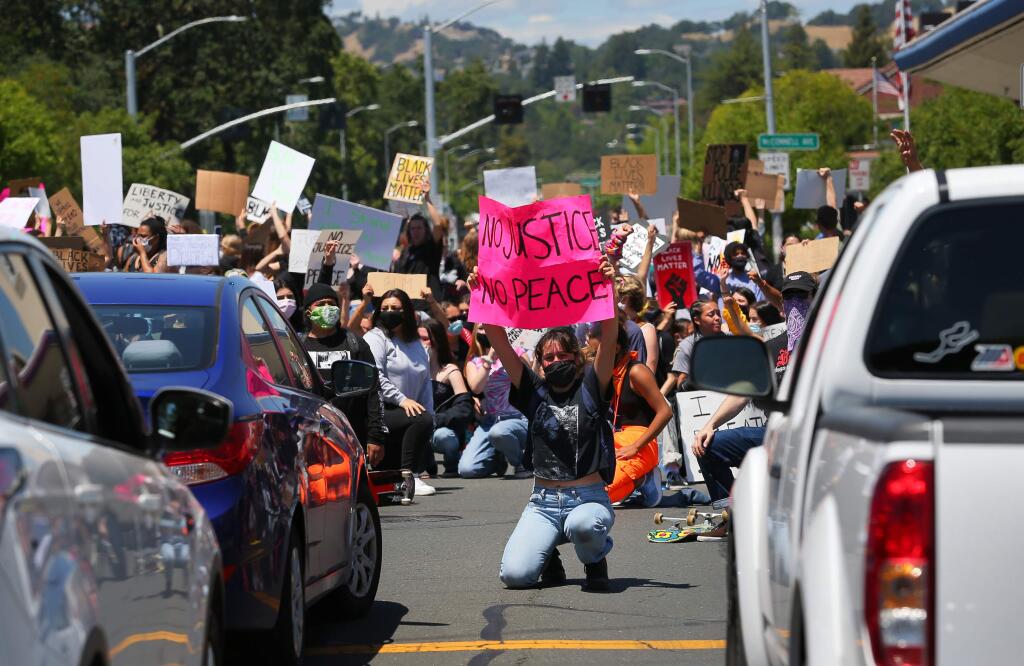 Protesters marching against police brutality block the intersection of Mendocino and Pacific avenues in Santa Rosa on Monday, June 1, 2020. (Christopher Chung/ The Press Democrat)