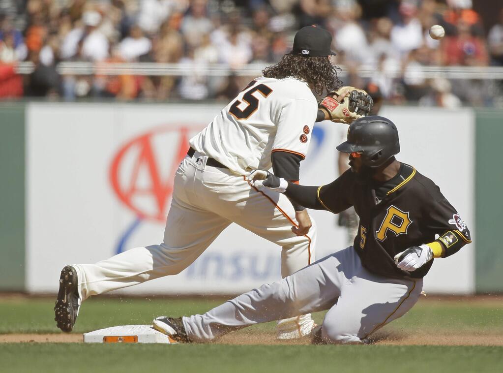Pittsburgh Pirates' Josh Harrison slides safely into second base for a double as San Francisco Giants shortstop Brandon Crawford waits for the throw in the ninth inning Wednesday, Aug. 17, 2016, in San Francisco. Pittsburgh won the game 6-5. (AP Photo/Eric Risberg)