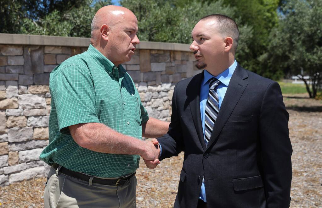 Robert Kennedy, right, shakes hands with Hanna Boys Center executive director Brian Farragher during his press conference in Sonoma on Wednesday, June 26, 2019. Kennedy and his brother, allegedly abused at the Hanna Boys Center, announced a $6.8 million settlement with the school. (Christopher Chung/ The Press Democrat)