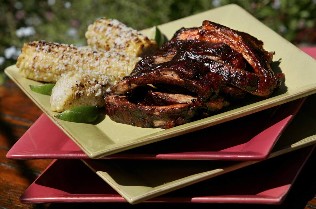 Ribs made with Matt Sherburn's custom dry rub and Ravenswood BBQ sauce, and grilled corn on the cob with chipotle aioli and lime. (Christopher Chung/ The Press Democrat)