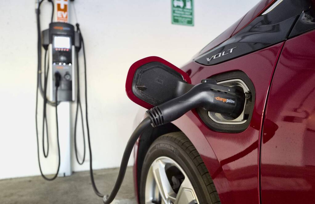 California is shifting the focus of its incentive program for electric cars toward less affluent buyers. (RICHARD VOGEL / Associated Press)
