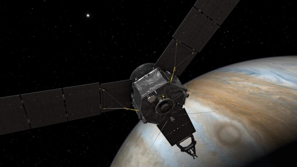 This illustration depicts NASA's Juno spacecraft at Jupiter, with its solar arrays and main antenna pointed toward the distant sun and Earth. Juno arrived in Jupiter orbit July 4, with the mission of imporvoing our understanding of the solar system's beginnings by revealing the origin and evolution of Jupiter. (NASA)