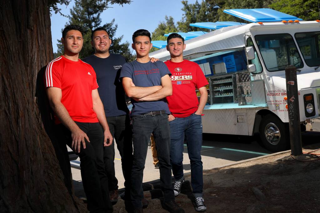 The Vazquez brothers: Andre, left, Rick, Sebastian, and Jorge, with their Guerneville Taco Truck.(Christopher Chung/ The Press Democrat)