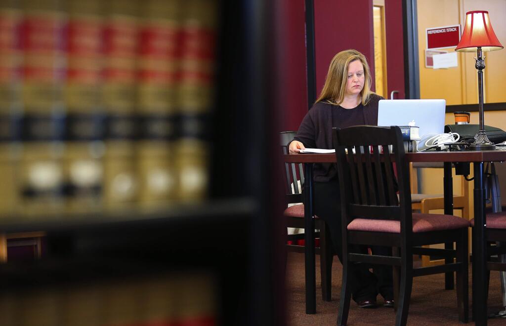 Darla Schoenrock uses the Sonoma County Law Library in Santa Rosa, on Friday, March 18, 2016. (Christopher Chung/ The Press Democrat)