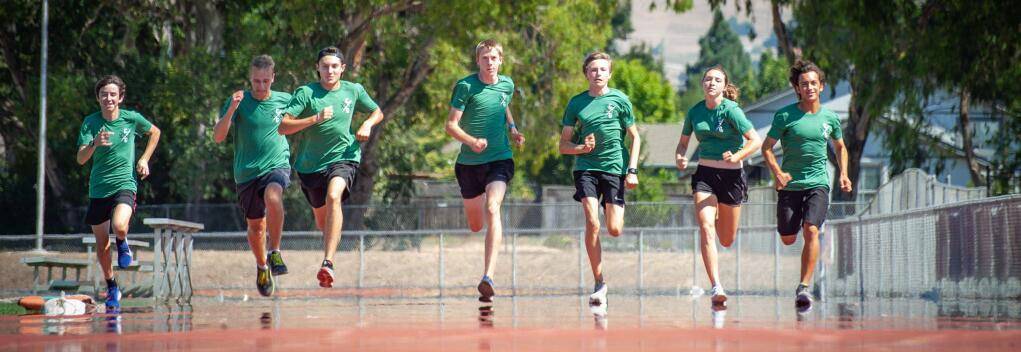 ANDREW GOTSHALLRunning with one eye on a repeat VVAL championship and the other on the state meet for Casa Grande are, left to right, Nolan Hosbein, Luke Baird, Logan Moon, Will Hite, Jacob Dietlin, Emma Basell and Aaron Beaube.