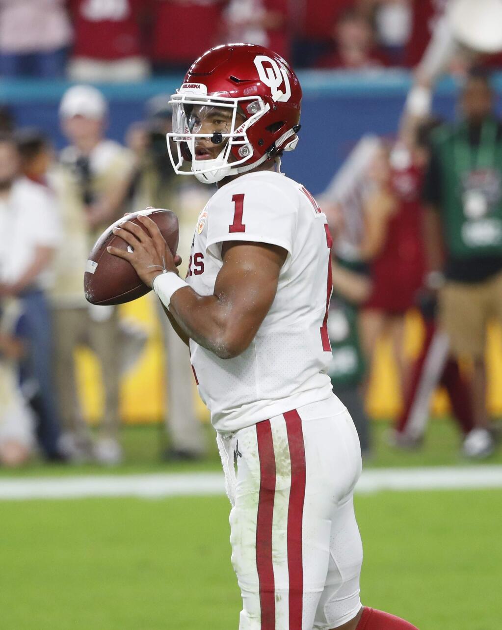 Oklahoma quarterback Kyler Murray (1) looks to pass, during the first half of the Orange Bowl NCAA college football game against Alabama, Saturday, Dec. 29, 2018, in Miami Gardens, Fla. (AP Photo/Wilfredo Lee)