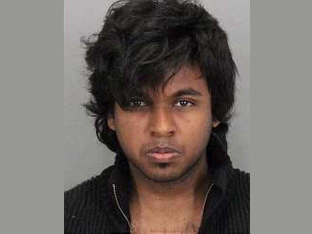 This undated photo provided by the San Jose, Calif., Police Department shows suspect Hasib Bin Golam Rabbi who was arrested with his brother in connection with the shooting deaths of their parents. Golam Rabbi, 22, and his 17-year-old brother were taken into custody days after their parents were found slain Sunday, April 24, 2016, in their San Jose home. Police didn't release the teen's name because of his age. (San Jose Police Department via AP)