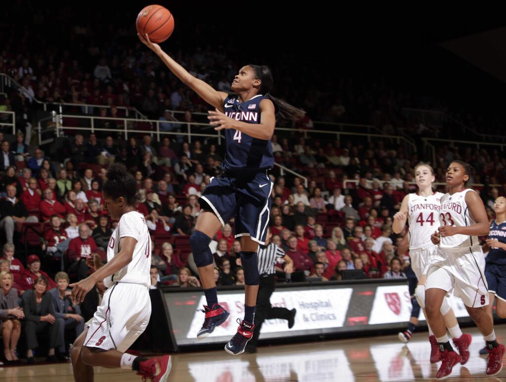 Connecticut guard Moriah Jefferson, center, goes up for a basket against Stanford during the first half of an NCAA college basketball game on Monday, Nov. 17, 2014, in Stanford, Calif. (AP Photo/Marcio Jose Sanchez)