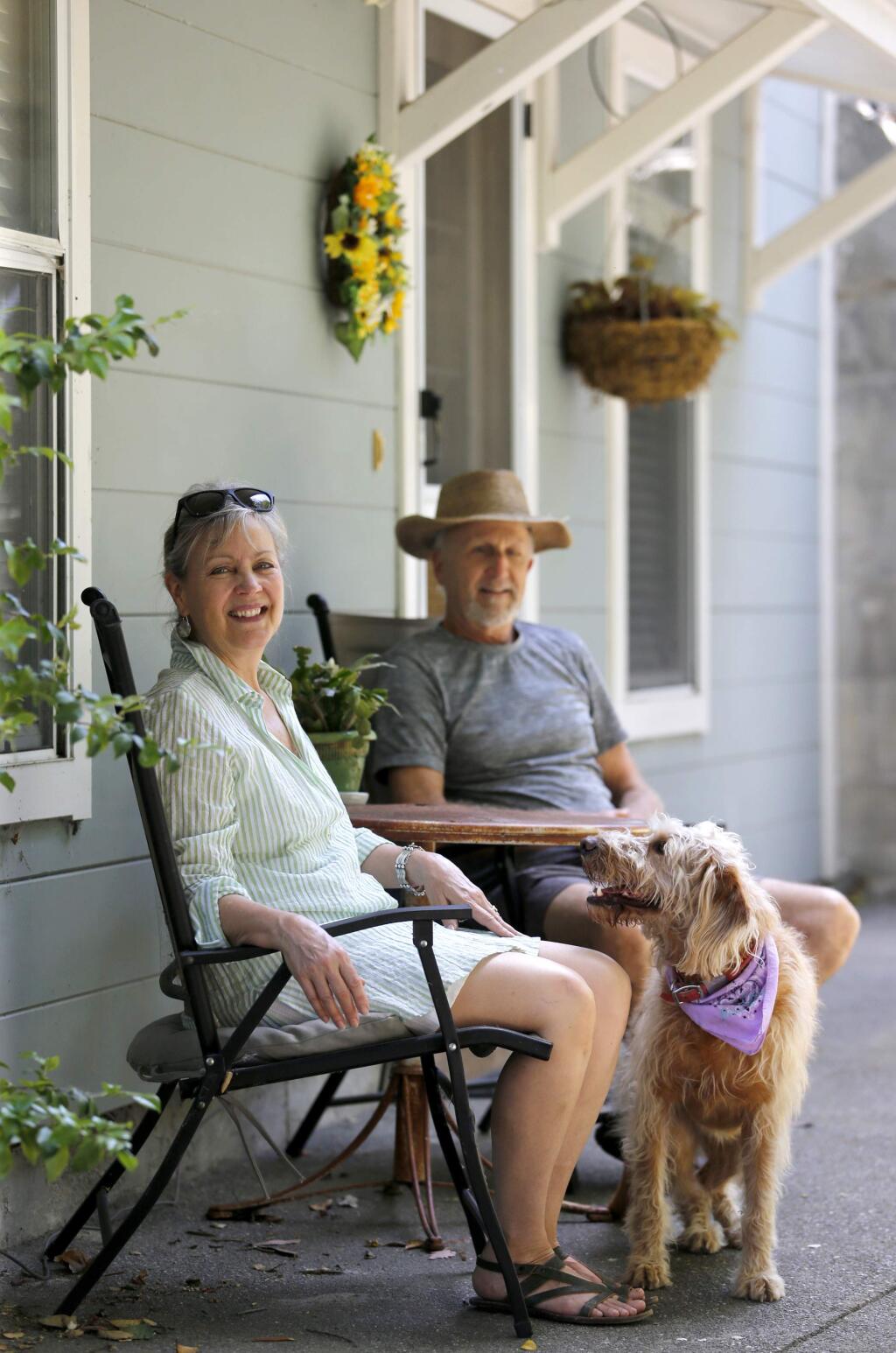 Laurie and Jim Vogel sit outside their permitted vacation rental in Petaluma on Sunday, June 3, 2018. (Beth Schlanker/ The Press Democrat)