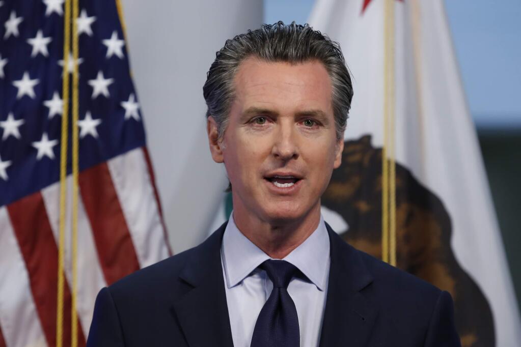 California Gov. Gavin Newsom discusses an outline for what it will take to lift coronavirus restrictions during a news conference at the Governor's Office of Emergency Services in Rancho Cordova, Calif., Tuesday, April 14, 2020. Newsom said he won't loosen the state's mandatory stay-at-home order until hospitalizations, particularly those in intensive care units, 'flatten and start to decline.'(AP Photo/Rich Pedroncelli, Pool)