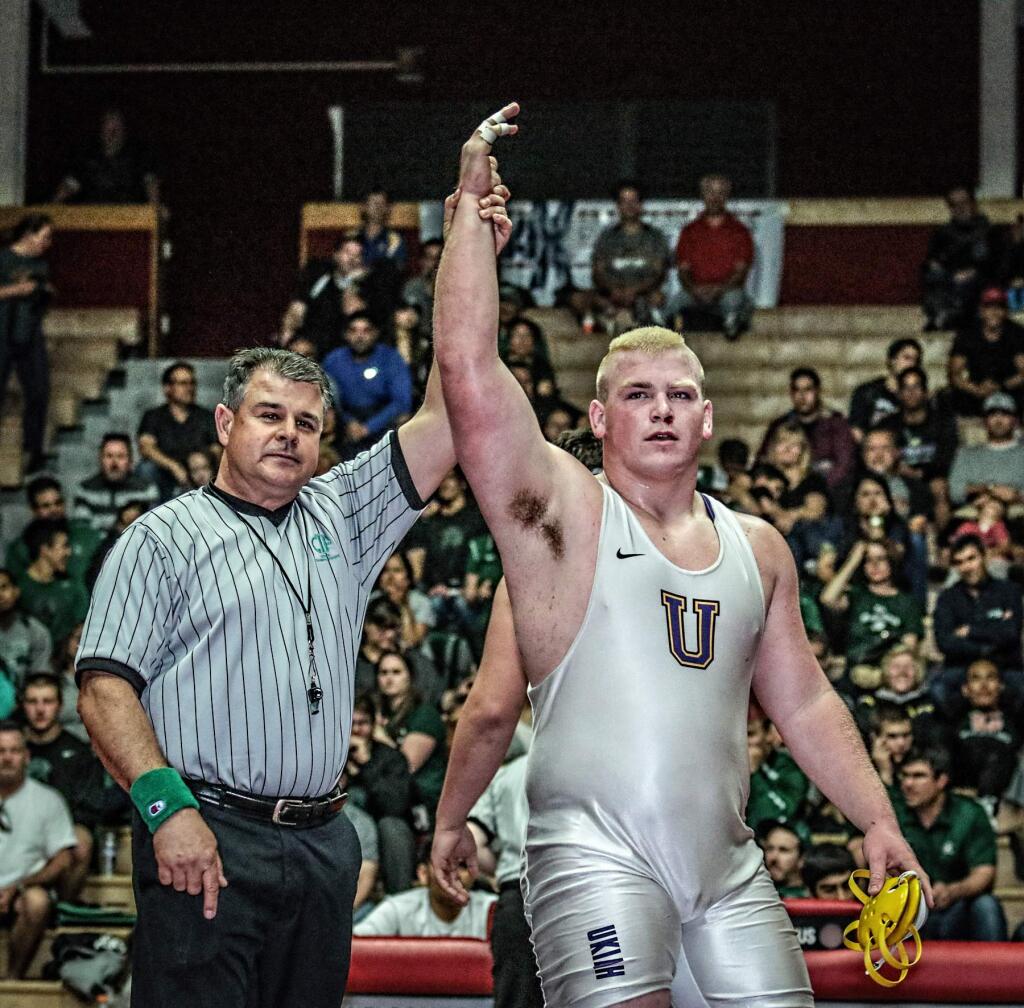 Ukiah's Nic Iversen has his arm raised in victory after winning the North Coast Section 285-pound title Saturday night at James Logan High School in Union City. (John Sachs / For The Press Democrat)