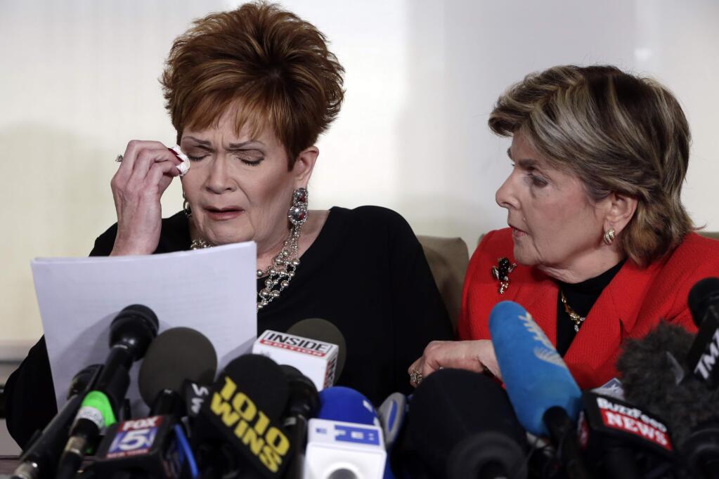 Beverly Young Nelson,the latest accuser of Alabama Republican Roy Moore, reads her statement as attorney Gloria Allred looks on, at a news conference Monday in New York. (RICHARD DREW / Associated Press)