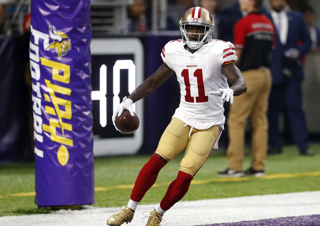 San Francisco 49ers wide receiver Marquise Goodwin celebrates after catching a touchdown pass during the first half of an NFL preseason football game against the Minnesota Vikings, Sunday, Aug. 27, 2017, in Minneapolis. (AP Photo/Jim Mone)