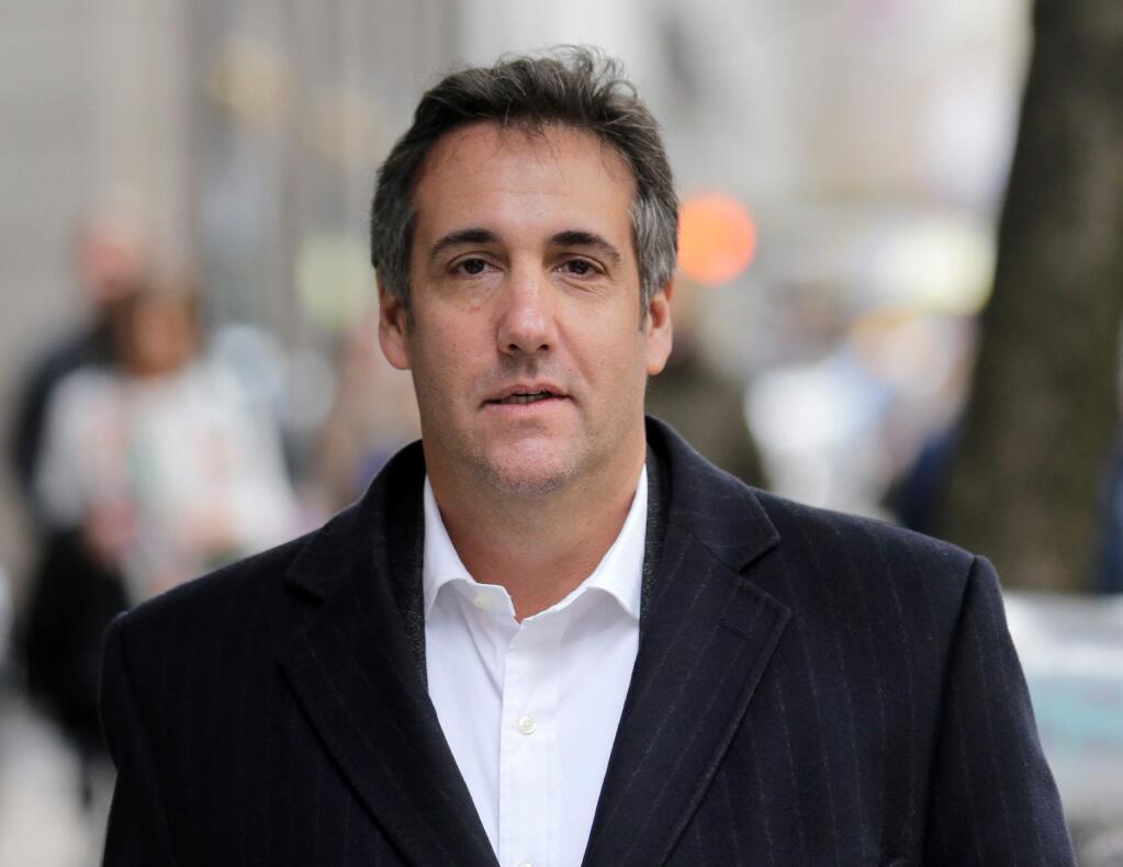 FILE - In this April 11, 2018, file photo, Michael Cohen, President Donald Trump's personal attorney, walks along a sidewalk in New York. Cohen is searching for a new legal team to represent him in an FBI investigation of his business dealings. A person familiar with the matter told The Associated Press on Wednesday, June 13 that Cohen's current legal team plans to stop handling the case. It wasn't clear what prompted the change or who would take over. (AP Photo/Seth Wenig, File)