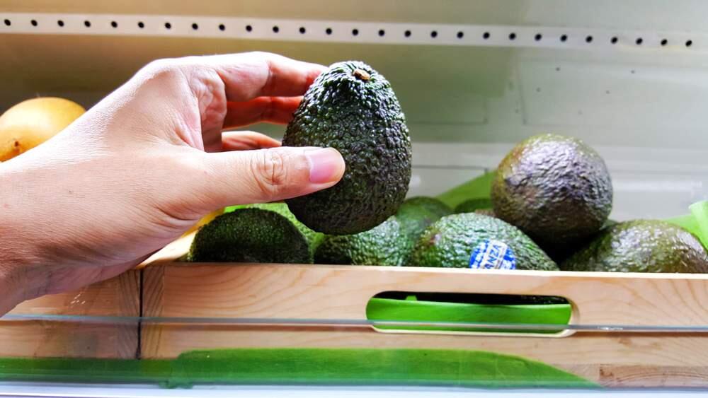 Lovin,' touchin,' squeezin': Avocados are among the most handled fruit in the market.