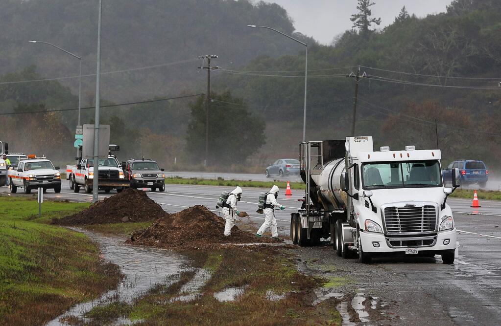 The right lane of northbound Highway 101 and the South Cloverdale Boulevard offramp are closed while a hazardous materials team works on containing a chemical spill after a truck caught fire in Cloverdale on Wednesday, December 18, 2019. (Christopher Chung/ The Press Democrat)