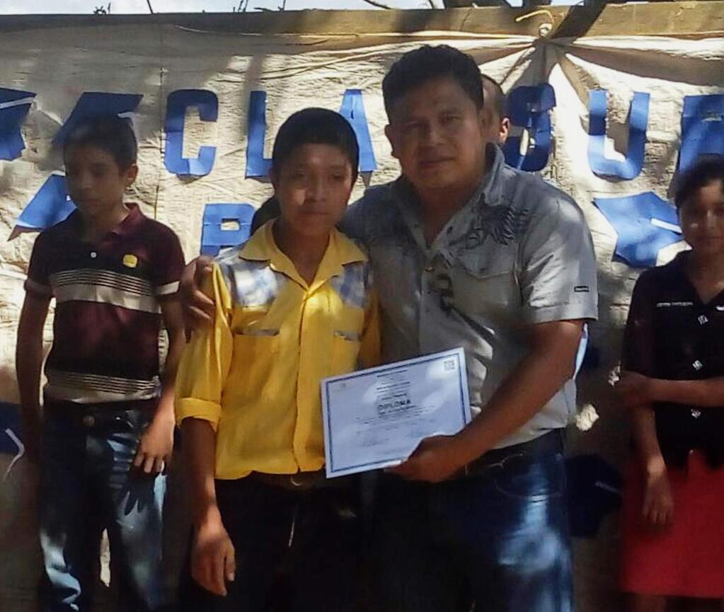 In this Oct. 31, 2018 photo released by Jimmy Cristian Gutierrez Garcia, the teacher of child migrant Juan de Leon Gutiérrez, shows Juan posing with his teacher Jimmy during a school contest in El Tesoro village, Camotan, Guatemala. The 16-year-old died on April 30 after officials at a South Texas youth detention facility noticed he was sick, becoming the third Guatemalan child to die in U.S. custody since December. (Jimmy Cristian Gutierrez Garcia via AP)