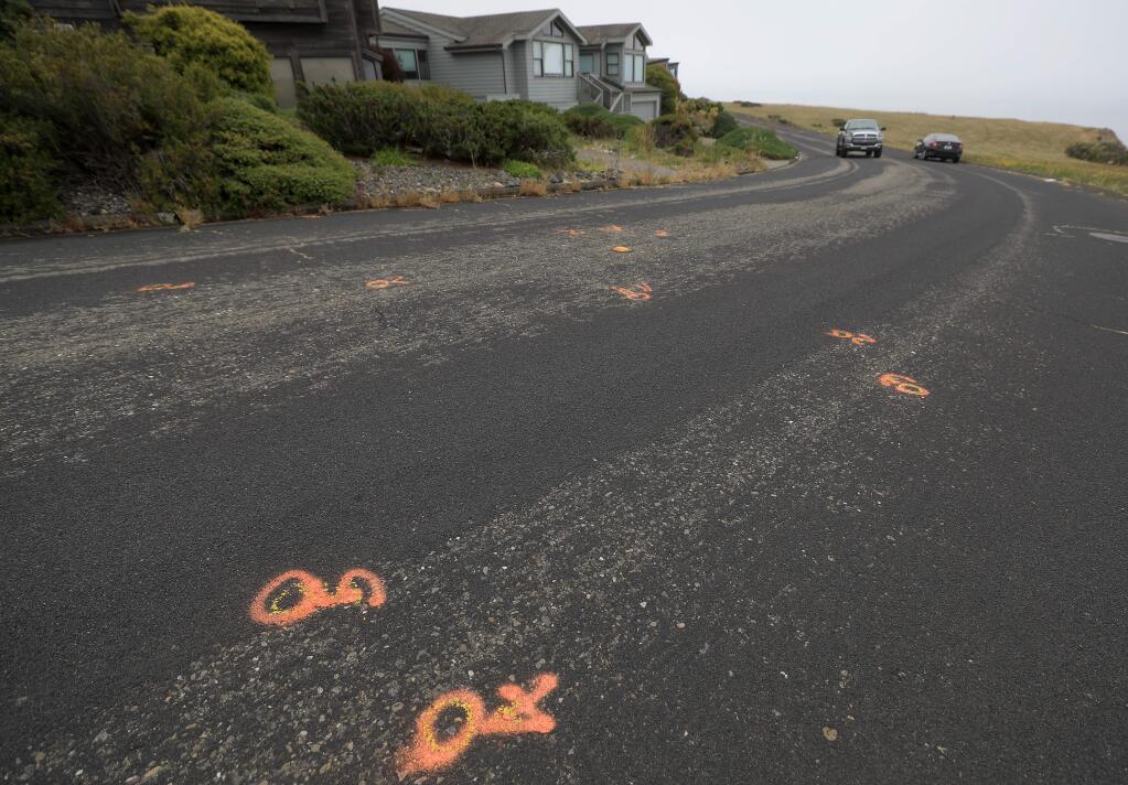 On Pelican Loop Road in Bodega Bay, Friday, July 5, 2019, investigation marks pinpoint the location of an officer involved shooting Thursday, July 4. (Kent Porter / The Press Democrat) 2019