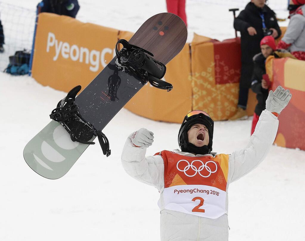 Shaun White, of the United States, celebrates winning gold after his run during the men's halfpipe finals at Phoenix Snow Park at the 2018 Winter Olympics in Pyeongchang, South Korea, Wednesday, Feb. 14, 2018. (AP Photo/Gregory Bull)