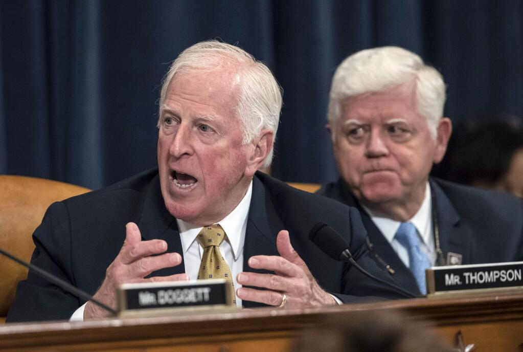 Rep. Mike Thompson, D-Calif., joined at right by Rep. John Larson, D-Conn., questions House Ways and Means Committee Chairman Kevin Brady, R-Texas, about tax relief provisions for disaster victims as the panel begin the markup process of the GOP's far-reaching tax overhaul, on Capitol Hill in Washington, Monday, Nov. 6, 2017. (AP Photo/J. Scott Applewhite)