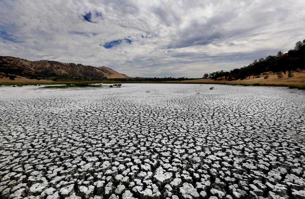 Indicative of California's intensifying drought, Borax Lake above the city of Clearlake, fed mostly by winter run-off, shows the strain of three years of low rainfall totals, Friday Aug. 29, 2014. (KENT PORTER/ PD FILE)