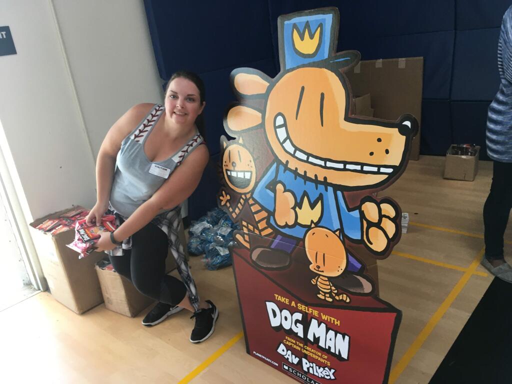 Kim Blosch stands ready to hand out some free Dog Man shwag to more than a thousand kids from ten North Bay schools.