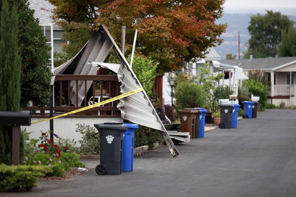 Burned debris from homes is taped off at the Napa Valley Mobile Home Park following Sunday's earthquake on Monday, August 25, 2014 in Napa, California. (BETH SCHLANKER/ The Press Democrat)