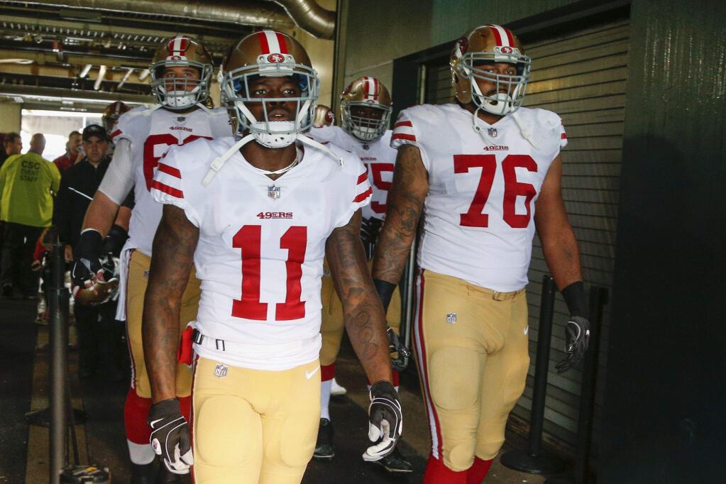 San Francisco 49ers wide receiver Marquise Goodwin and offensive tackle Garry Gilliam wait to take the field against the Philadelphia Eagles, Sunday, Oct. 29, 2017, in Philadelphia. (AP Photo/Chris Szagola)