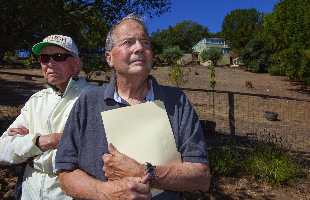 Robbi Pengelly/Index-TribuneKen Marshall (left) and Tom Jones in front of one of the vacation rental properties causing problems at Diamond A Ranch, outside of Sonoma.